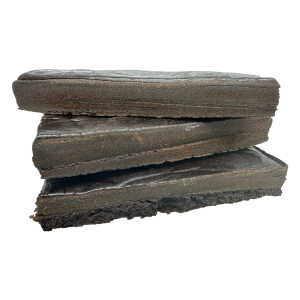 Stacked Afghani Black Gold hash blocks showcasing their rich, dense structure.