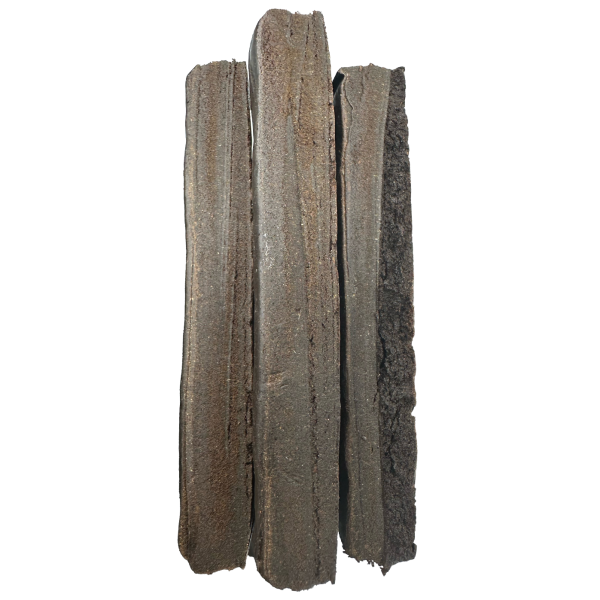 Flat rectangular pieces of Afghani Black Gold hash with a dark, oily surface.