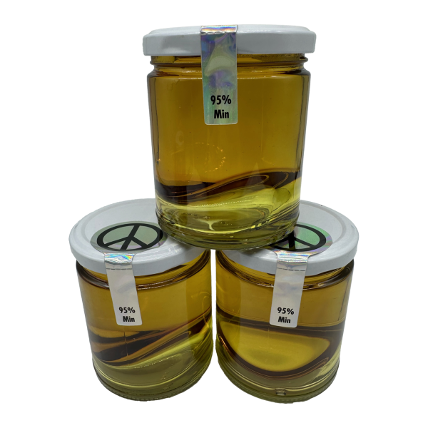 Three stacked glass jars of premium 95% THC distillate, displaying a clear, golden-yellow liquid.