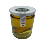 Close-up view of a premium THC distillate jar showing its super-clear color and high-quality content.