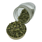 Jar of El Chapo Shake cannabis spilling onto a lid, displaying a mix of small buds and shake.