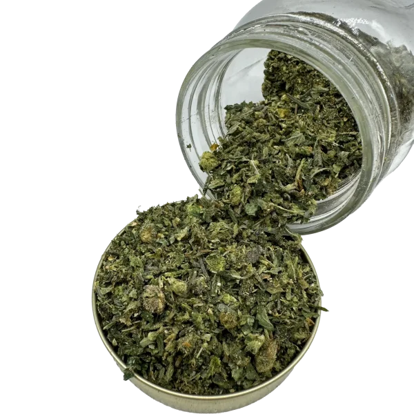 Rockstar Shake cannabis blend spilling from a jar into a tin, showing texture