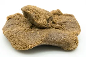 Close-up of soft, sticky hash with smooth texture and high oil content.