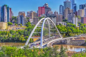 View of the Walterdale Bridge and Edmonton city skyline on a sunny day.