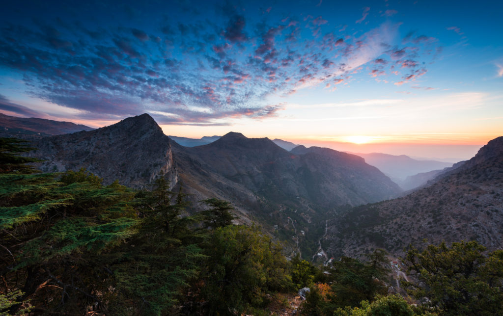 Sunset over cedar forests and mountain valleys in Lebanon, origin of Lebanese blonde hash