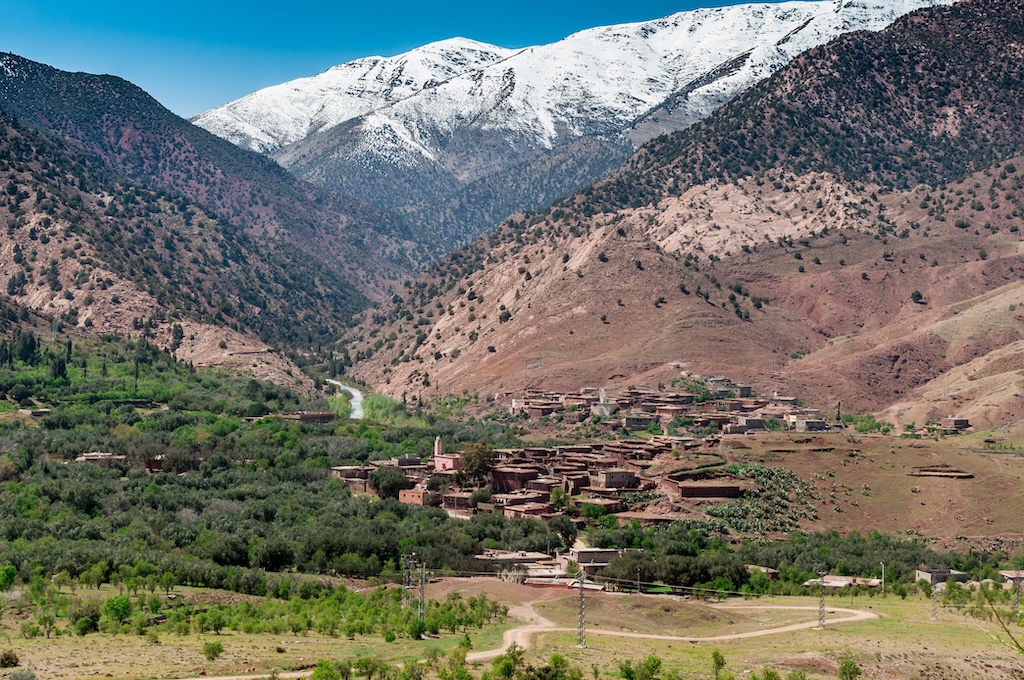 Village beneath the snow-capped Atlas Mountains in Morocco, homeland of Moroccan hash